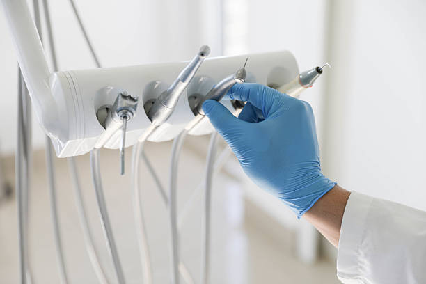 Professional Emergency Dentist technician working in Woodlawn Beach, FL